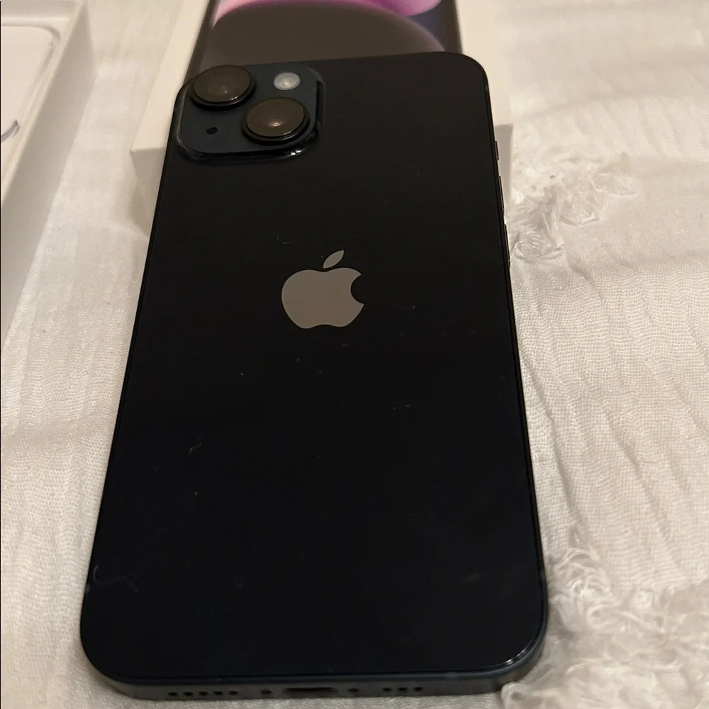 Apple iPhone with Black Screen and White Packaging